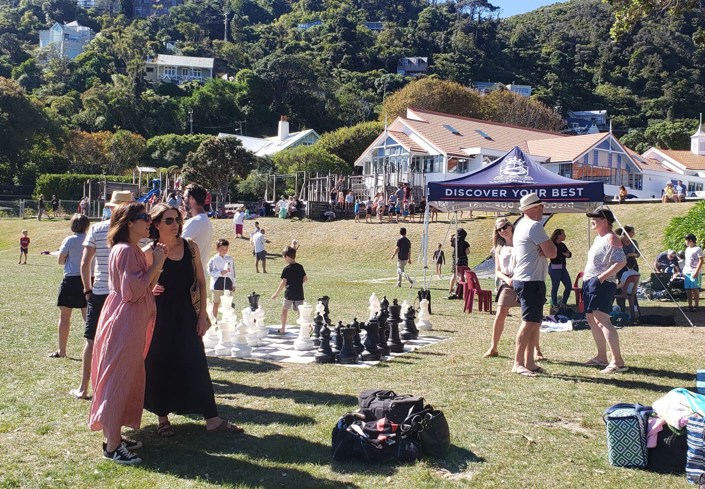 Sunny day at Days Bay with Wellesley College parents outdoors, enjoying the weather near the waterfront and greenery